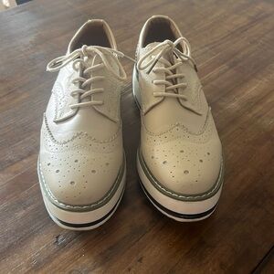 Cream Oxfords with a rubber sole